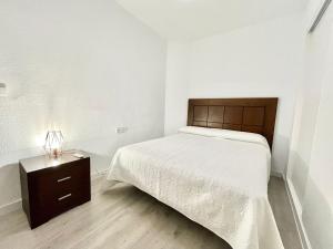 Posteľ alebo postele v izbe v ubytovaní Apartamento 3 dormitorios centro Villajoyosa
