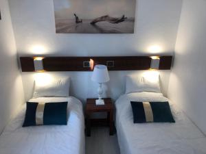 Ένα ή περισσότερα κρεβάτια σε δωμάτιο στο Appartement idéalement situé