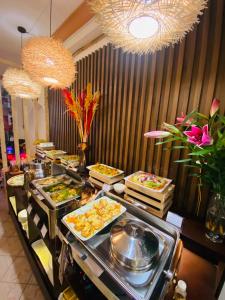 a buffet line with many different types of food at Na Nue Hotel in Ho Chi Minh City +37 photos
