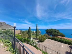 a view of the ocean from a balcony at Magarà Apartment by Casa in mente in Cefalù