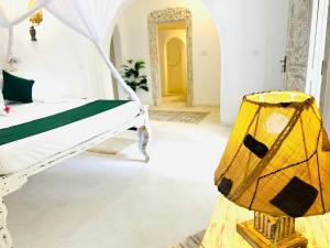 Postel nebo postele na pokoji v ubytování Dream Luxury B&b Watamu