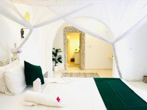 Postel nebo postele na pokoji v ubytování Dream Luxury B&b Watamu
