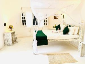 Postel nebo postele na pokoji v ubytování Dream Luxury B&b Watamu