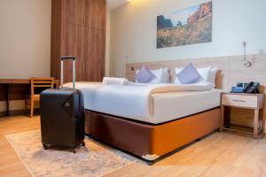 Letto o letti in una camera di Kyriad Muscat