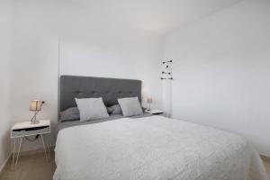 Łóżko lub łóżka w pokoju w obiekcie Casa Jable