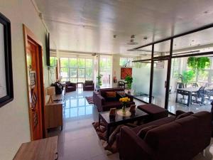 a large living room with couches and a table at ONYX B&B Bed and Breakfast in Euscara