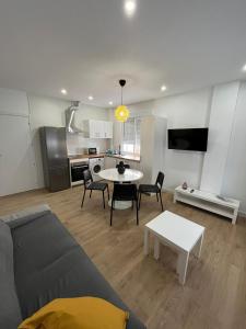a living room with a couch and a table at Apartamento San Antonio in Carboneras