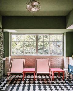 a room with three chairs and a window at Miami Hotel Bangkok in Bangkok +83 photos