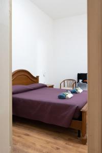 A bed or beds in a room at LA FENICE A.C.