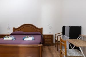 A bed or beds in a room at LA FENICE A.C.