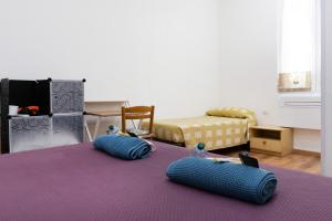 A bed or beds in a room at LA FENICE A.C.