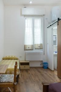 A bed or beds in a room at LA FENICE A.C.