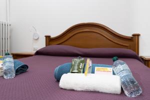 A bed or beds in a room at LA FENICE A.C.