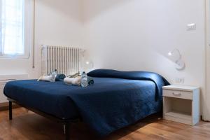 A bed or beds in a room at LA FENICE A.C.