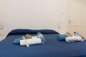 A bed or beds in a room at LA FENICE A.C.