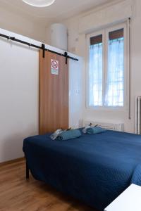 A bed or beds in a room at LA FENICE A.C.