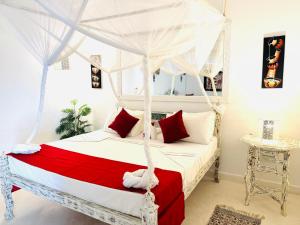 Postel nebo postele na pokoji v ubytování Dream Luxury B&b Watamu