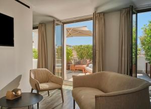 a living room with a couch chairs and a table at Sant Jaume Design Hotel in Palma de Mallorca +37 photos