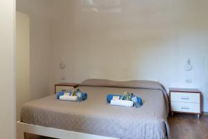 A bed or beds in a room at LA FENICE A.C.
