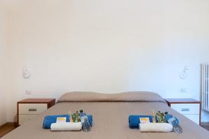 A bed or beds in a room at LA FENICE A.C.
