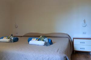 A bed or beds in a room at LA FENICE A.C.