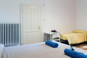 A bed or beds in a room at LA FENICE A.C.