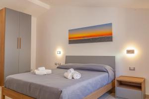 Postel nebo postele na pokoji v ubytování Isgrò Rooms