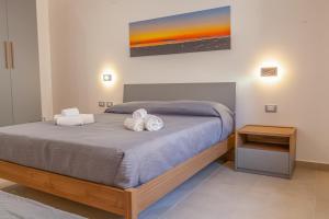 Postel nebo postele na pokoji v ubytování Isgrò Rooms