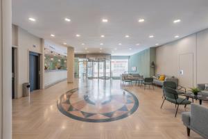 an office lobby with chairs and a table at Moon Dreams Calabahía in Cala del Moral +37 photos