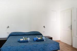 A bed or beds in a room at LA FENICE A.C.