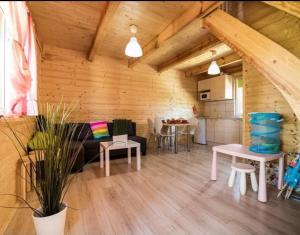 a living room with a couch and a table at Baltic Holiday in Dębki