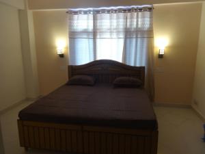 Un pat sau paturi într-o cameră la Gursimrat Homestay