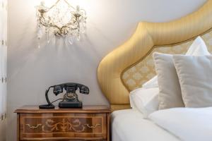 Postel nebo postele na pokoji v ubytování Hotel Adria