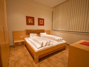 Postel nebo postele na pokoji v ubytování Apartments Obernosterer