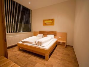 Postel nebo postele na pokoji v ubytování Apartments Obernosterer