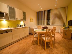 Kuchyň nebo kuchyňský kout v ubytování Apartments Obernosterer