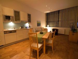 Kuchyň nebo kuchyňský kout v ubytování Apartments Obernosterer