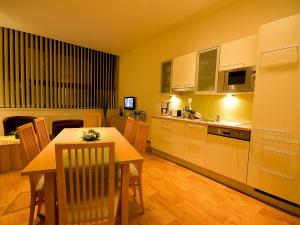 Kuchyň nebo kuchyňský kout v ubytování Apartments Obernosterer