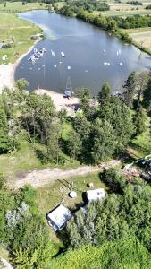 an aerial view of a lake with a bunch of boats at Camperowe Swawole - Bondi in Bielawa
