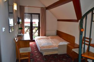 Posteľ alebo postele v izbe v ubytovaní Park Hotel Pruhonice