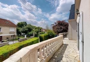 a white fence in front of a house at Stunning House 5-Bedrooms for 9P- 20min from Paris in Le Blanc-Mesnil