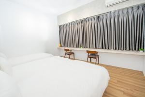 Voodi või voodid majutusasutuse Chao Hostel toas