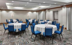 a conference room with tables and blue chairs at Hampton Inn & Suites Saratoga Springs Downtown in Saratoga Springs +83 photos
