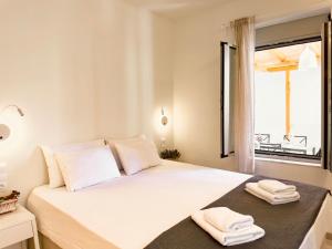 Postel nebo postele na pokoji v ubytování Kefi House Skiathos