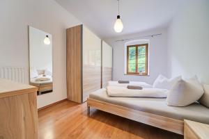 Voodi või voodid majutusasutuse Linslhof Apt Quarz toas