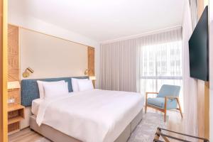 Voodi või voodid majutusasutuse Radisson Hotel Saint Denis, La Reunion toas