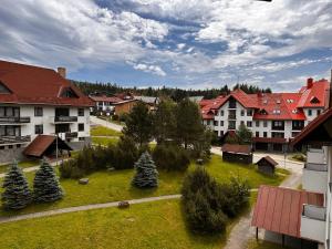 an aerial view of a town with houses and trees at Apartmán Chlupáč in Harrachov