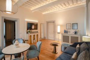 a living room with a couch and a table at La Monastica Resort & Spa in Borgo a Buggiano +143 photos