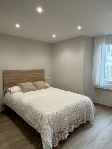 Ένα ή περισσότερα κρεβάτια σε δωμάτιο στο Apartamento en la playa Malpica de Bergantinos