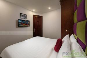 Postel nebo postele na pokoji v ubytování Vision Premier Hotel in Hanoi Central